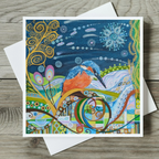 Colourful abstract art card with a kingfisher bird design on a wooden surface