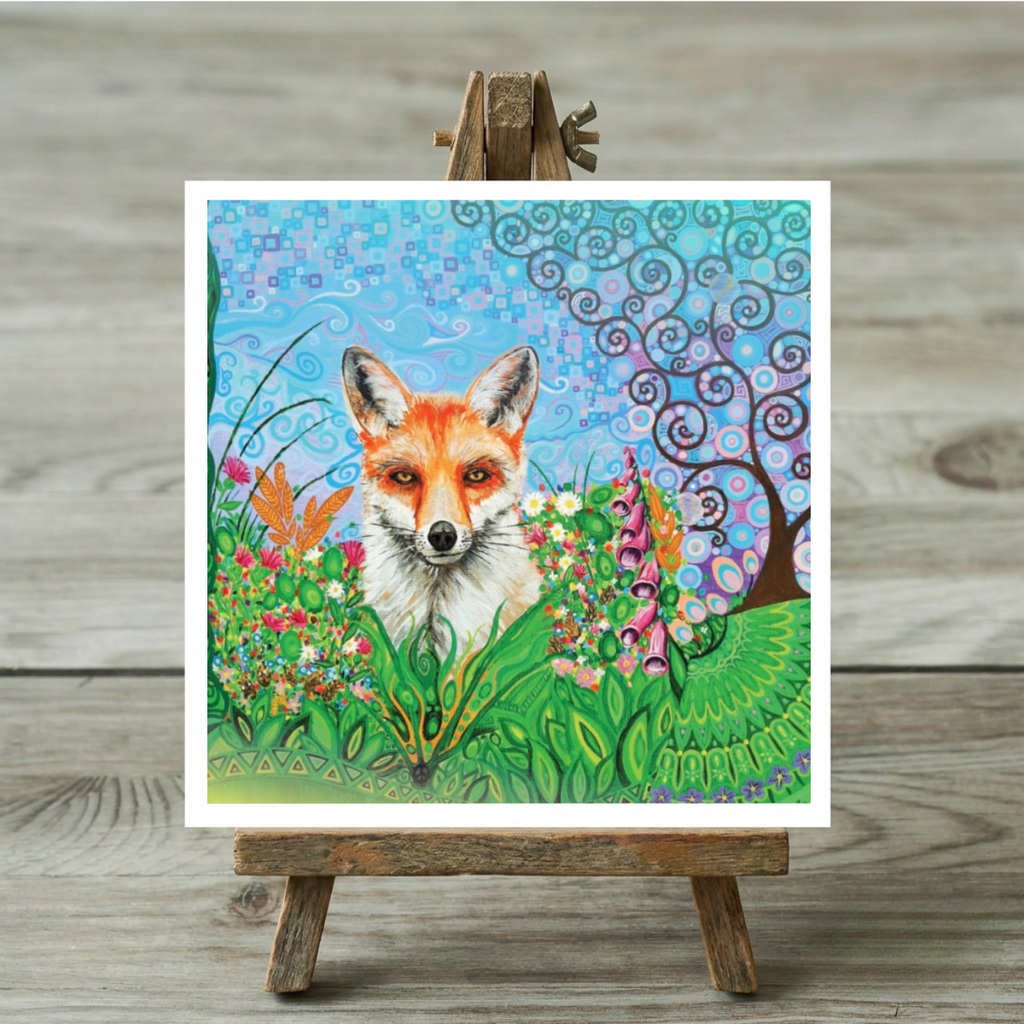 Colourful painting of a fox in a garden on a greeting card on a wooden easel