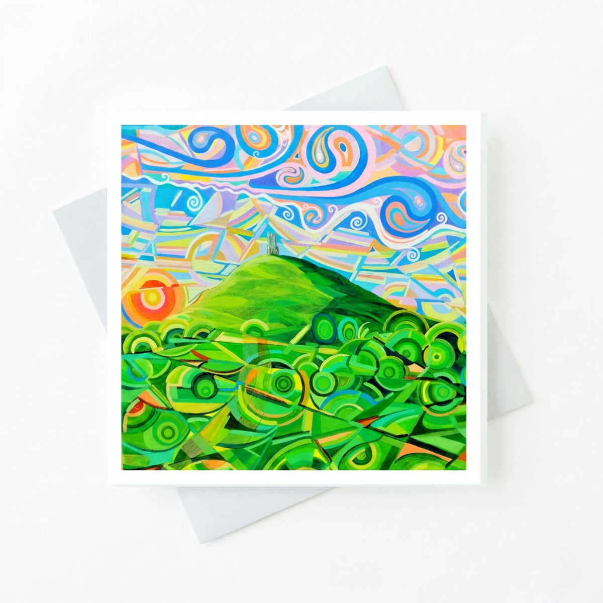 Colourful abstract landscape with green mountains and blue sky on a white card.
