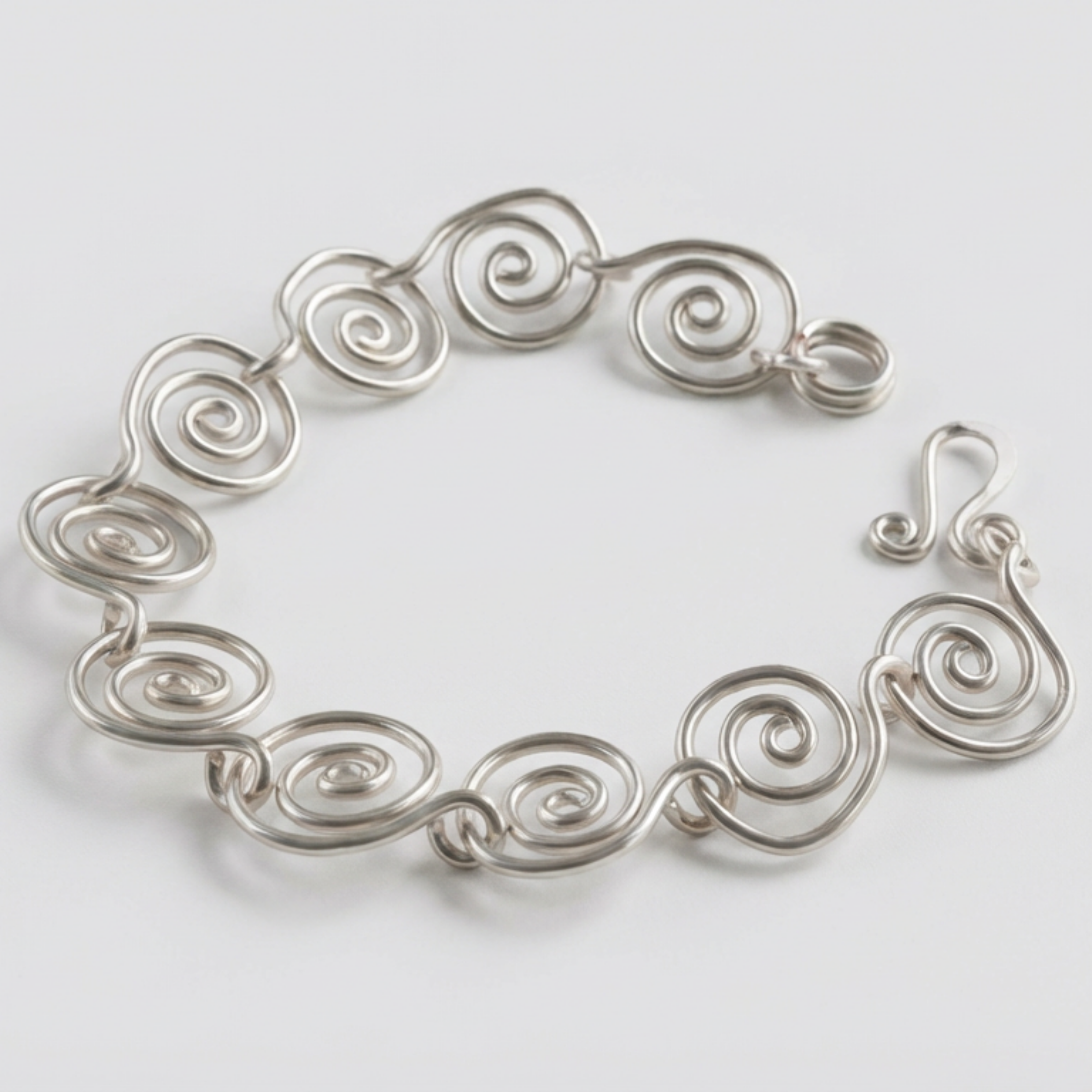 Detailed view of a silver spiral bracelet