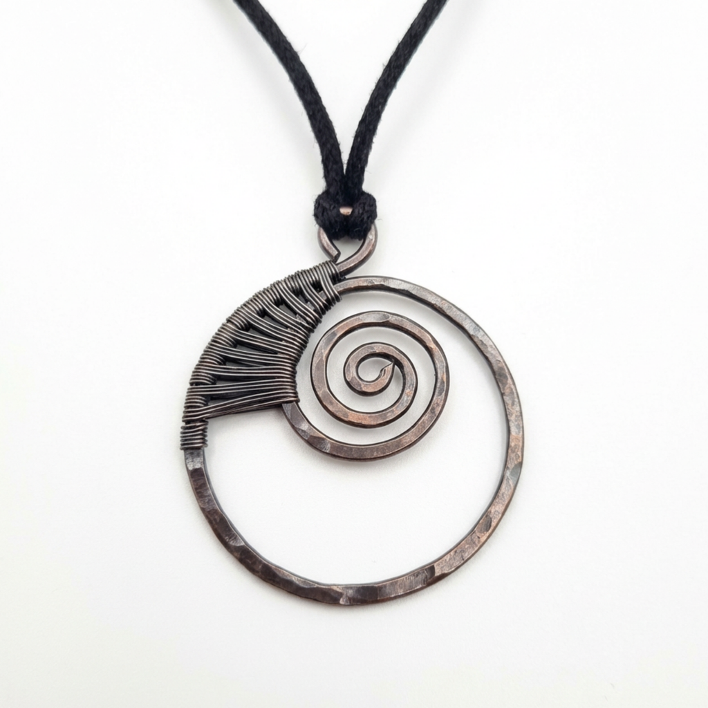 Necklace with a circular pendant featuring a spiral design on a white background