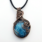 Necklace with a blue apatite stone pendant on a white background