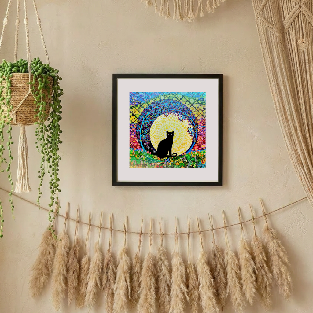 Framed artwork of a black cat silhouette against a colourful floral background, hanging on a wall with decorative elements.