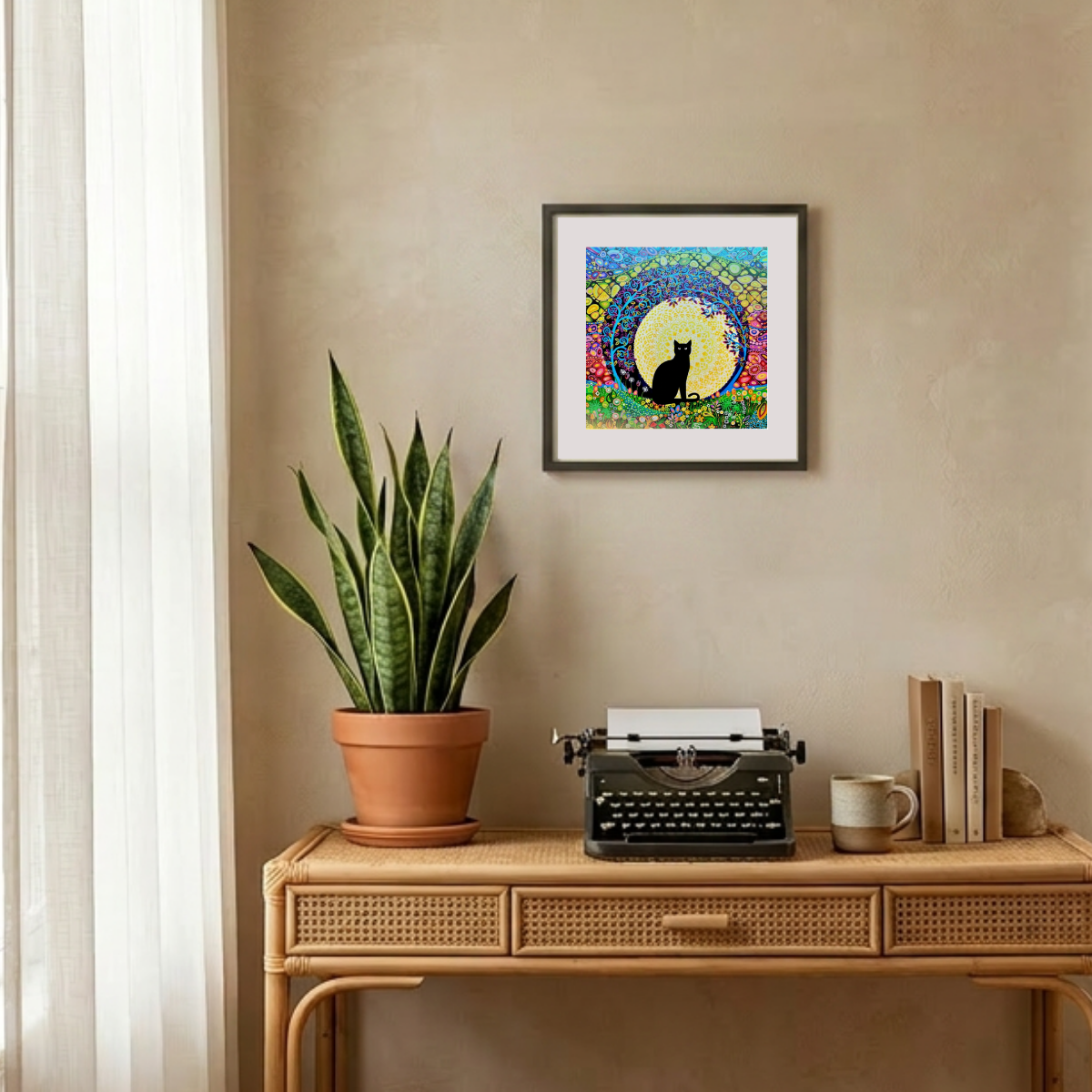 Decorative setup with a potted plant, typewriter, and framed artwork on a beige wall.