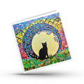 Colourful card with a black cat silhouette in the centre of a spiral tree mandala on a white background