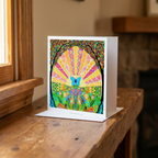 Colourful card with a butterfly design on a wooden surface