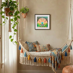 Decorative indoor swing with colourful pillows and a framed artwork on the wall.