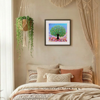 Decorative bedroom with a bed, wall art, and hanging plant.