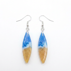 Pair of earrings with blue and gold design on a white background