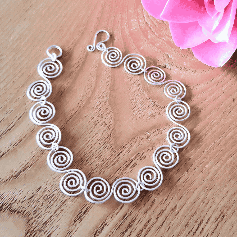 Detailed overhead view of a Celtic S spiral bracelet