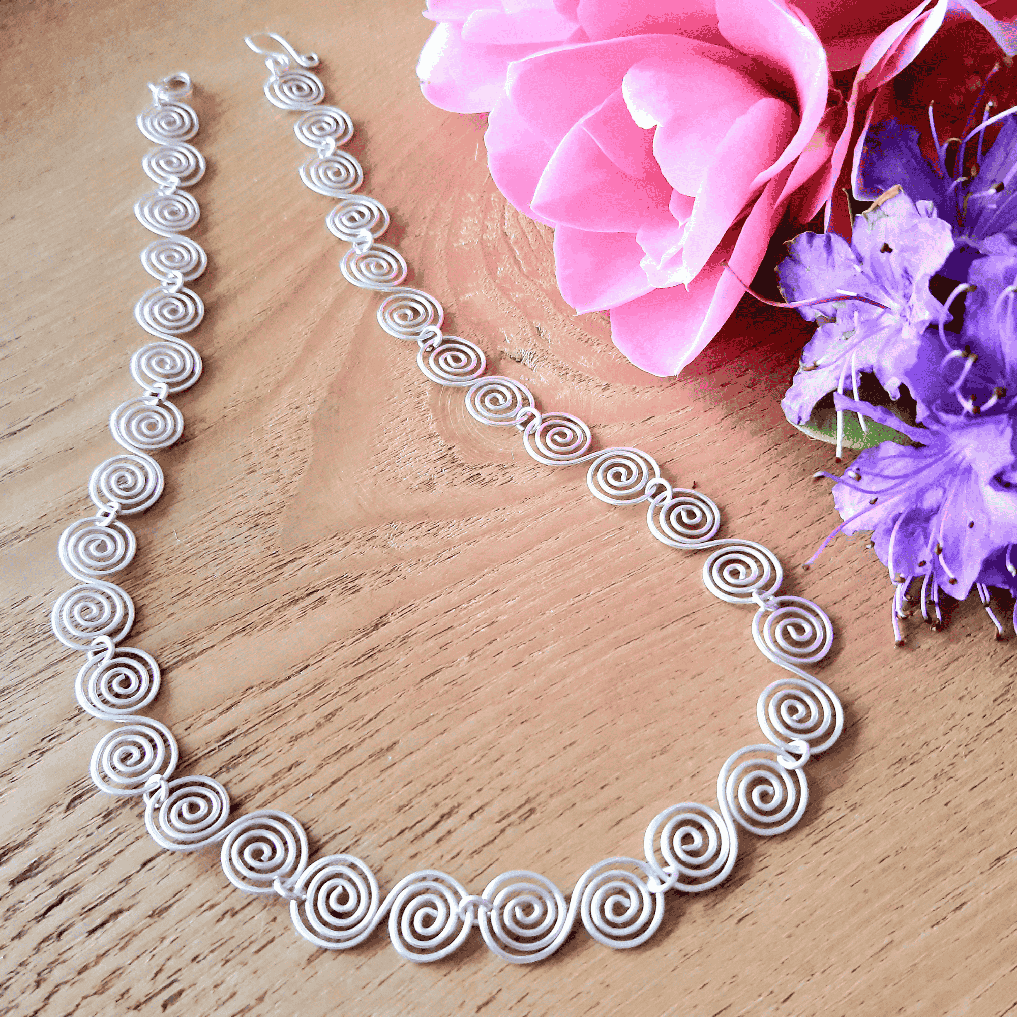 Handmade silver spiral necklace with S shaped spirals