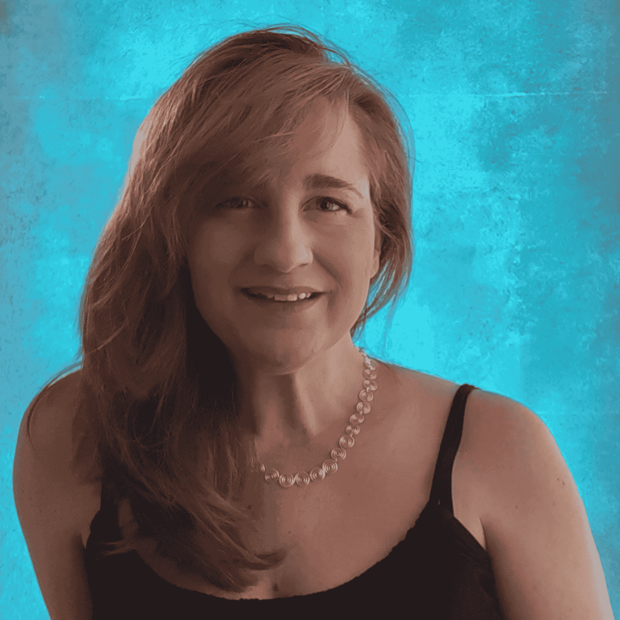 Woman with shoulder-length hair wearing a silver spiral necklace and a black top against a blue textured background