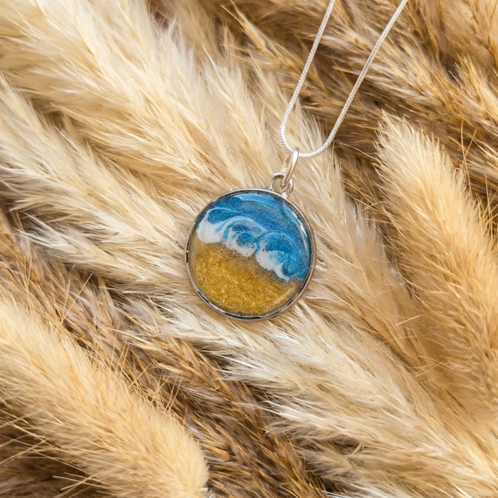 Necklace with a pendant featuring a blue and gold design on a fur background