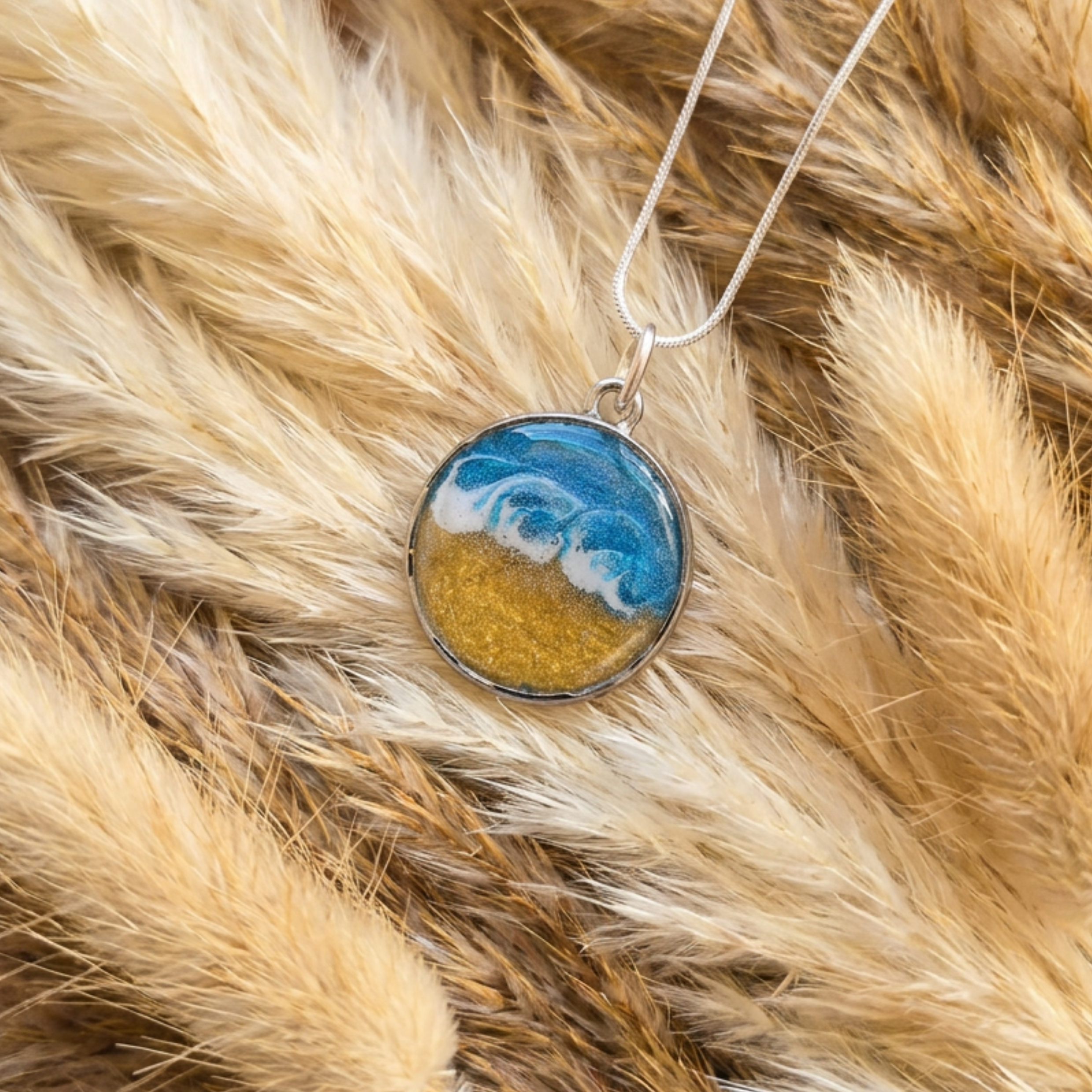 Necklace with a pendant featuring a blue and gold design on a fur background