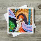 Colourful artwork of a woman with red hair on a wooden surface