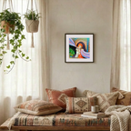 Cozy living room with patterned pillows, a coffee cup, and a colorful painting on the wall.