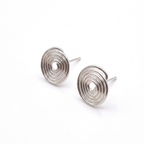 Pair of silver spiral earrings on a white background