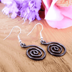 Open spiral copper earrings close-up detail, oxidised open wire design handmade UK