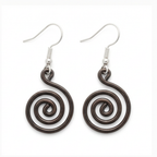 Open spiral copper earrings worn by model, rustic handmade jewellery UK