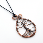 Copper tree of life necklace on a white background