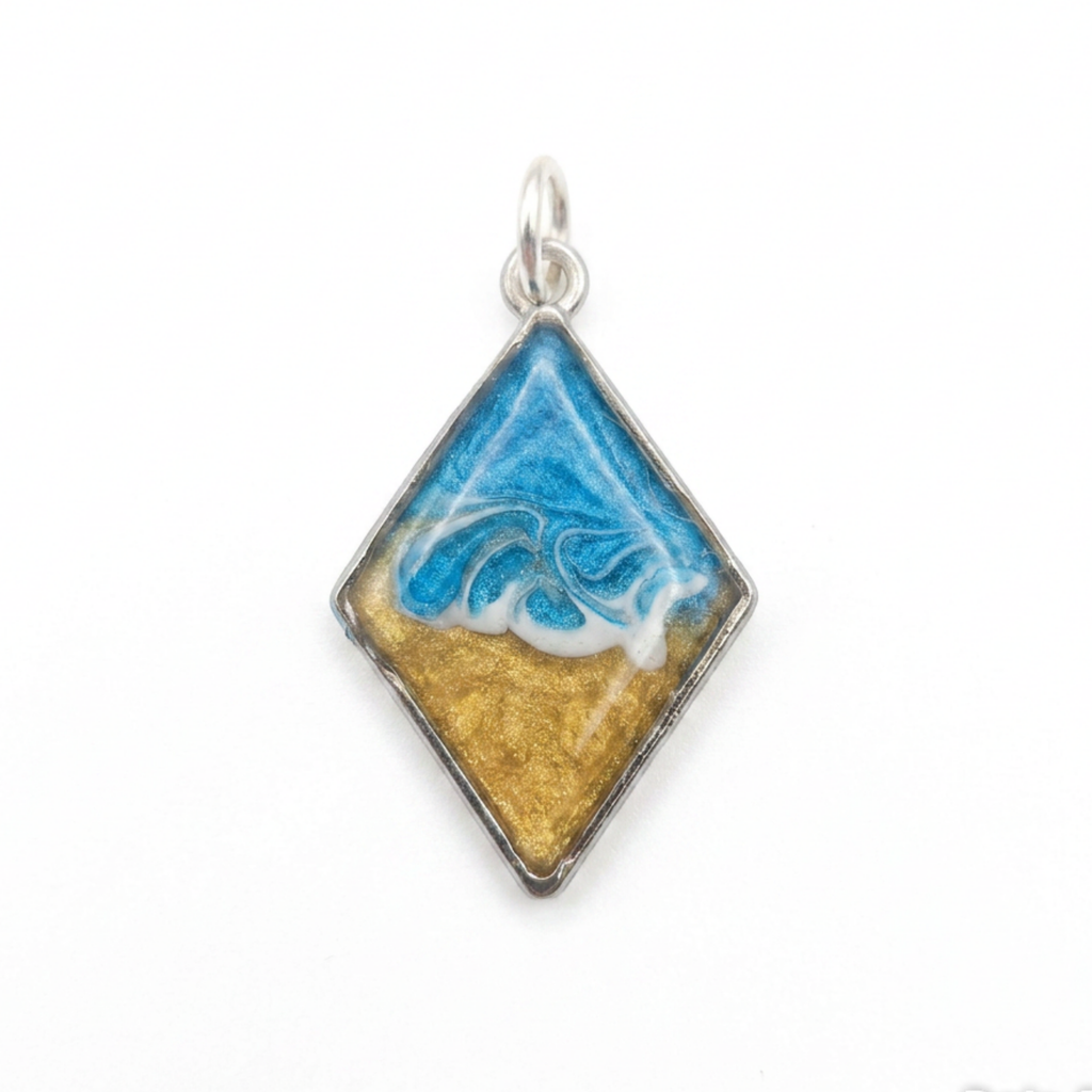 Silver diamond shaped pendant with a wave effect on a white background