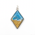 Silver diamond shaped pendant with a wave effect on a white background