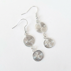 Silver spiral earrings on a white background