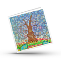 Colourful greeting card with a stylized tree of life design with a dragonfly on a white background