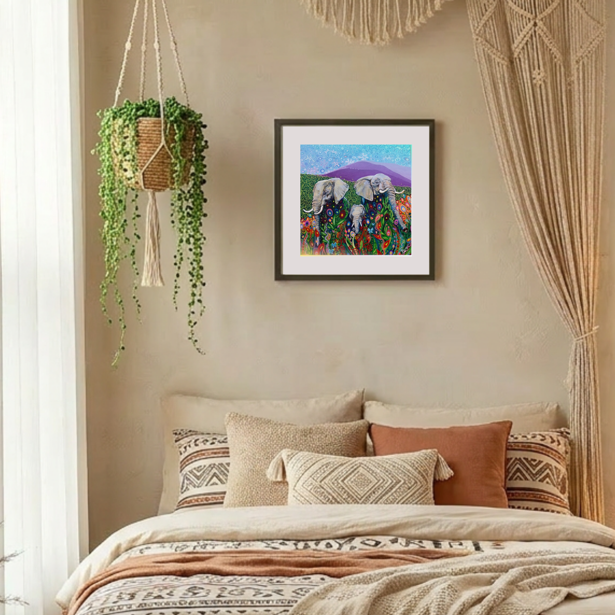 Decorative bedroom with a bed, pillows, and wall art featuring elephants.