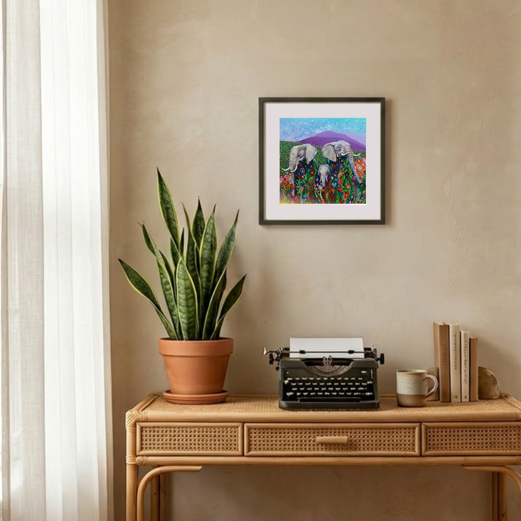 Decorative setup with a potted plant, typewriter, and framed artwork on a wooden console table.