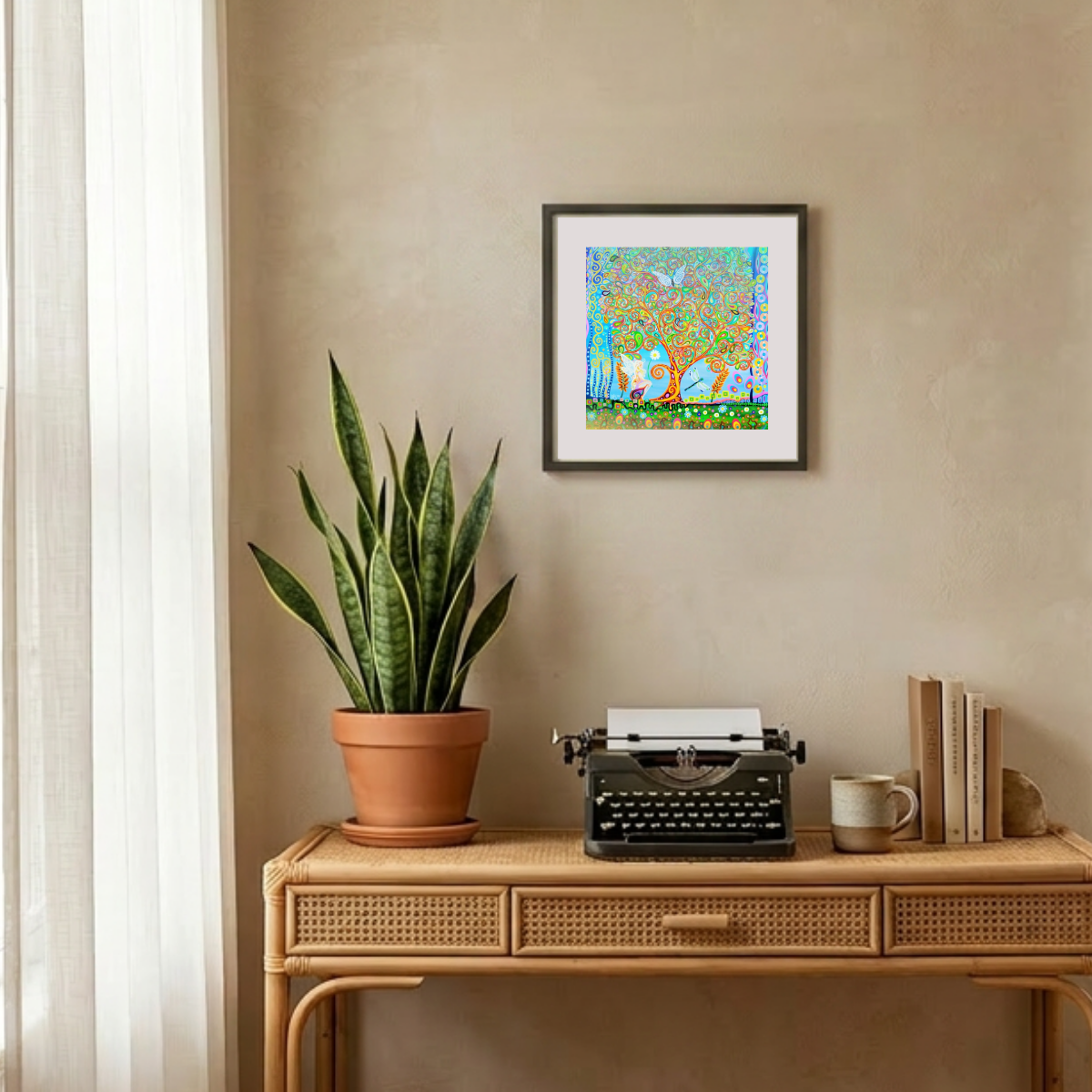 Decorative setup with a potted plant, typewriter, and framed artwork on a wooden console table.