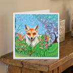 Greeting card with a fox illustration on a wooden surface