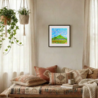 Cozy living room with a wooden bench, patterned cushions, and a framed abstract painting on the wall.
