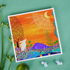 Colourful artwork of a hare and trees on a green background