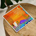 Colorful artwork on a wooden surface with a blurred background