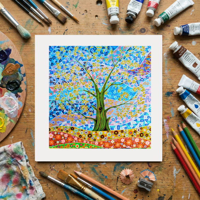 Colourful abstract artwork on a wooden surface with art supplies
