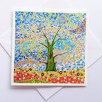 Colourful card with a tree of life with gold leaves design on a white background