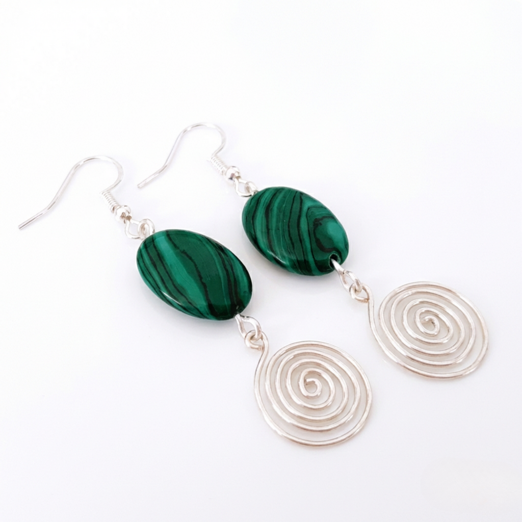 Green marbled earrings with silver spiral drops on a white background