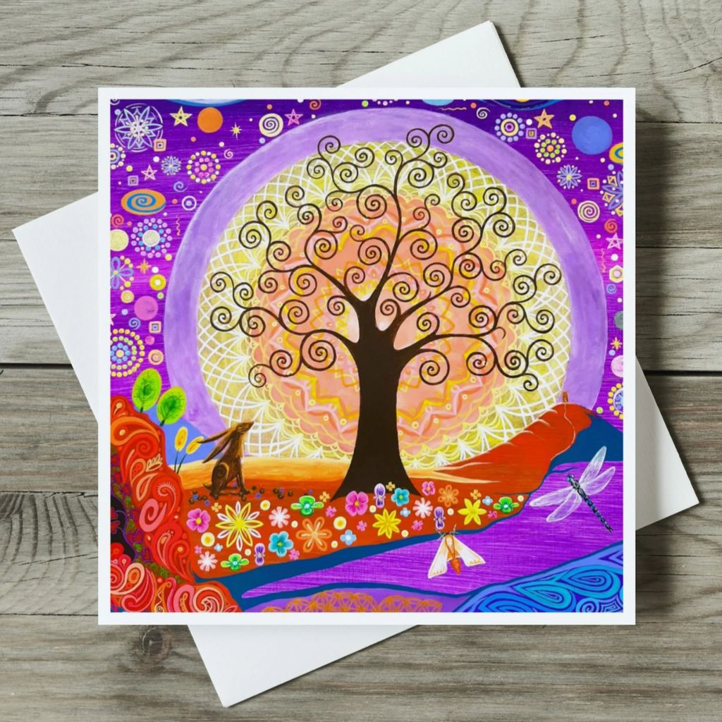 Colourful greeting card with a stylized tree design on a wooden surface