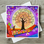 Colourful greeting card with a stylized tree design on a wooden surface