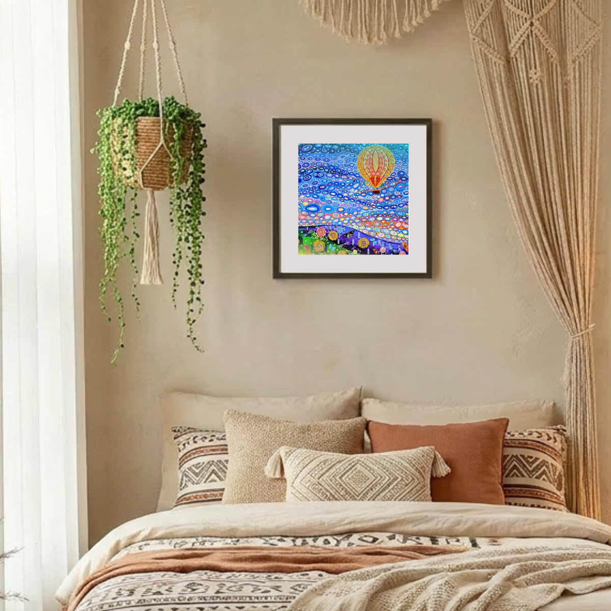 Decorative bedroom with a bed, pillows, and hot air balloon wall art.