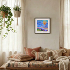 Cozy living room with patterned pillows, a colorful painting, and plants.