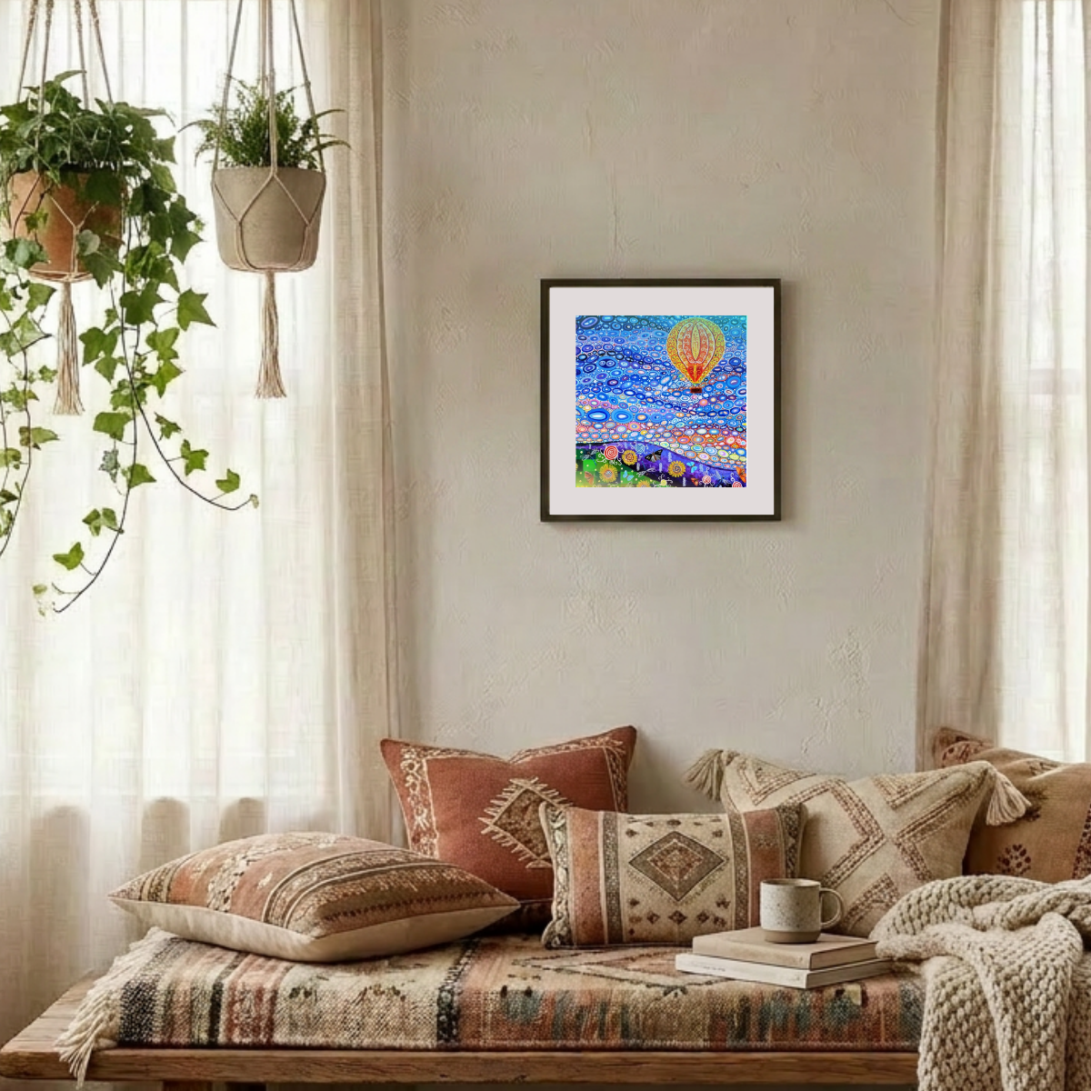 Cozy living room with patterned pillows, a colorful painting, and plants.