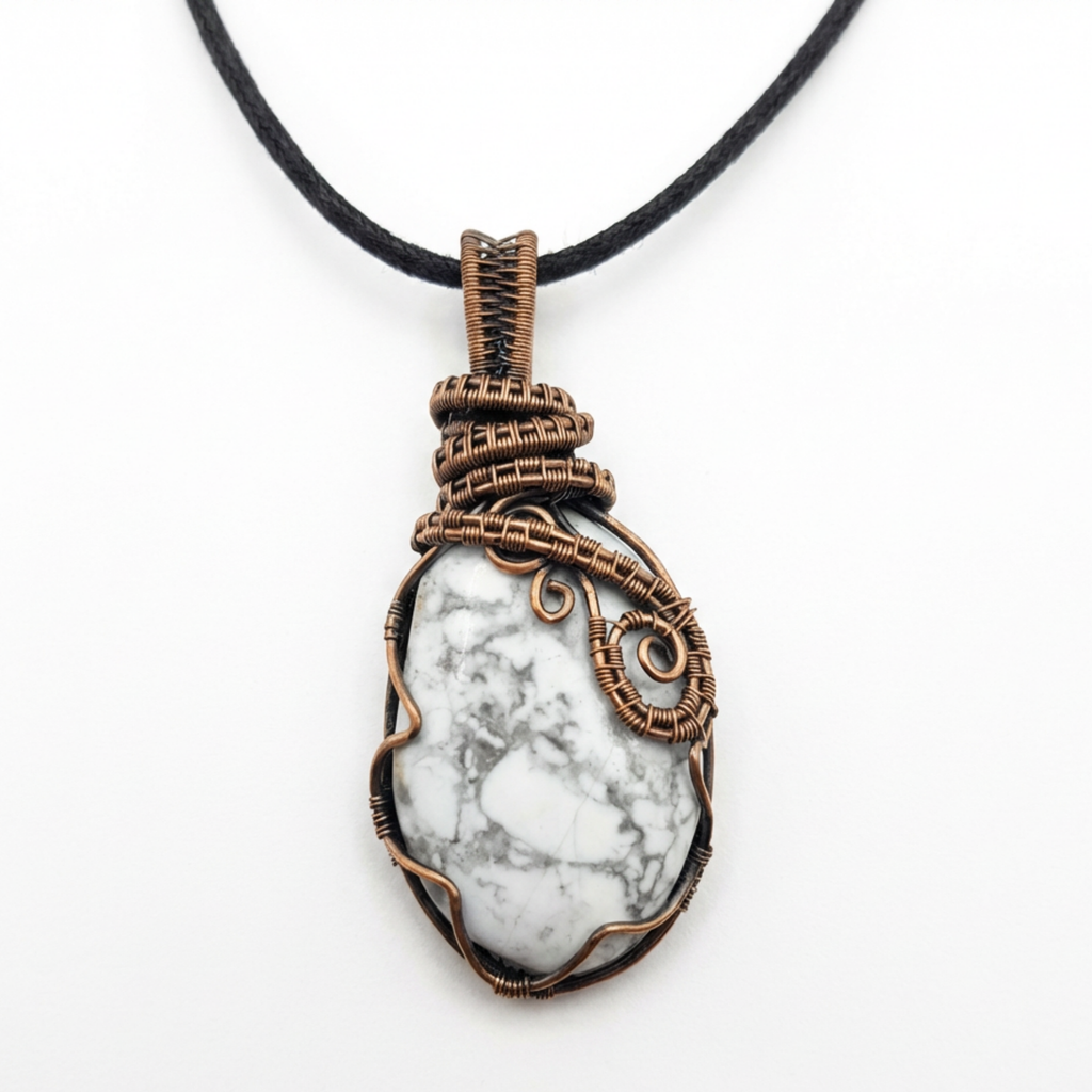 Necklace with a white stone pendant wrapped in bronzed copper wire on a white background