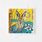 Greeting card with a colourful design featuring a hare and floral elements on a yellow background.