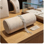 Shop display of a silver spiral necklace