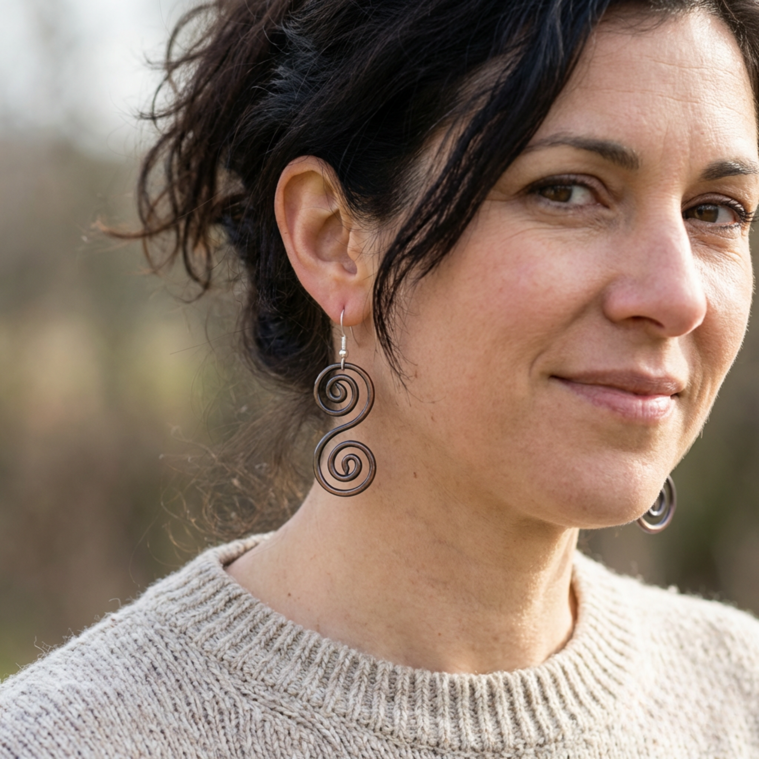 Model wearing some boho Celtic copper earrings