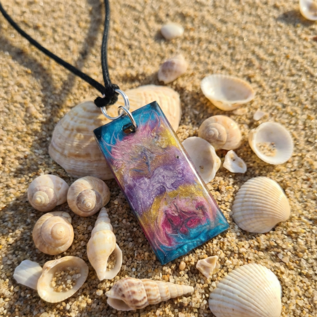 Colourful Rectangle resin pendant on the beach