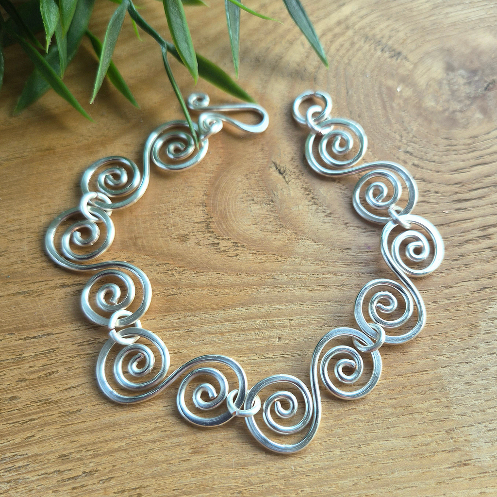 Silver bracelet with S shaped spirals