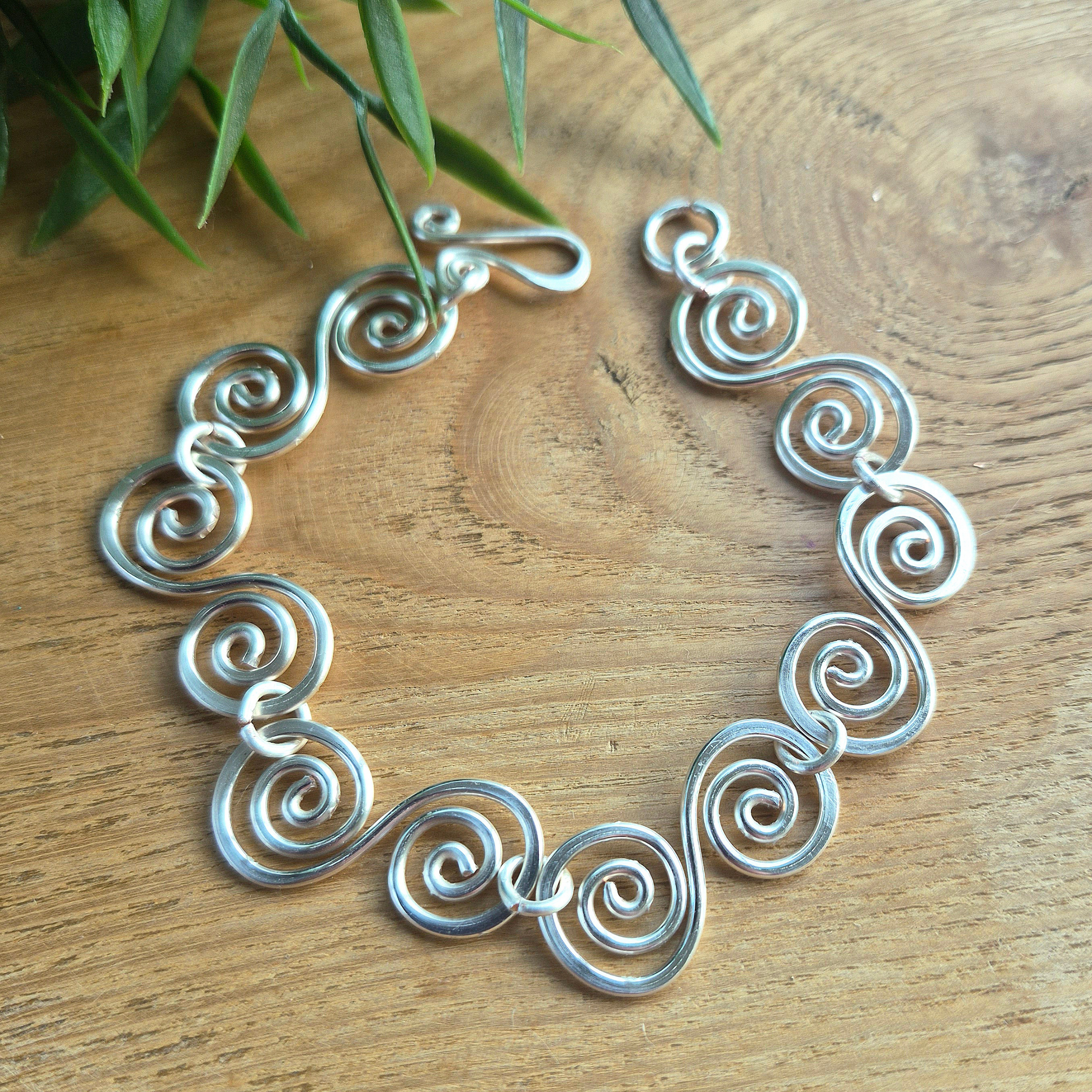 Silver bracelet with S shaped spirals